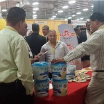 BD - World of the Latino Cuisine Trade Show - Photo - Aviva crackers making a big sale at 2014 Event